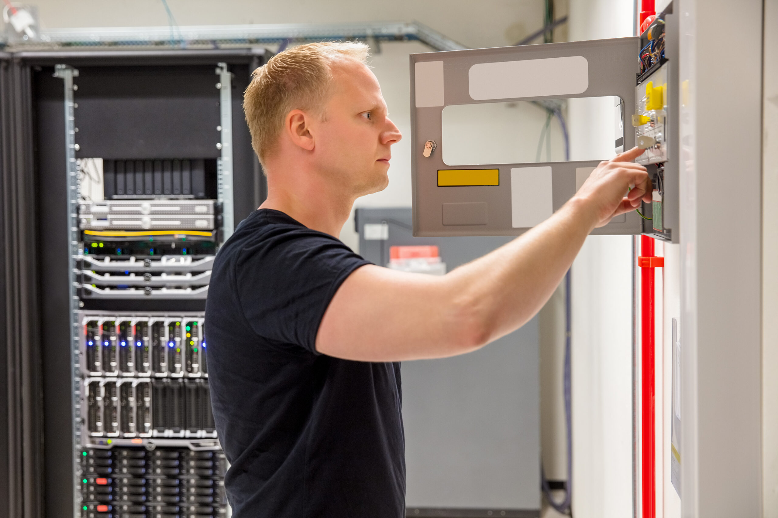 https://esxweb.com/wp-content/uploads/2023/02/confident-male-technician-checking-fire-panel-in-d-2022-12-16-09-52-27-utc-1-scaled.jpg